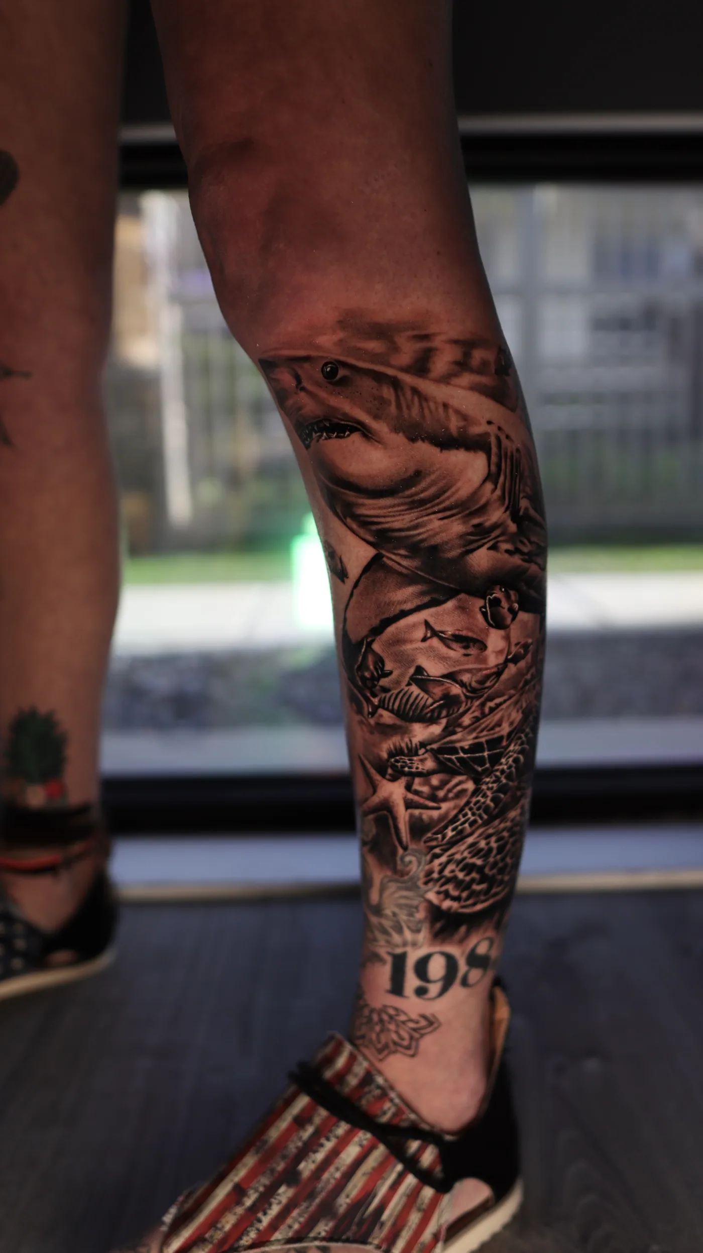 Leg composition, side view tattoo by Eddie Gonzalez