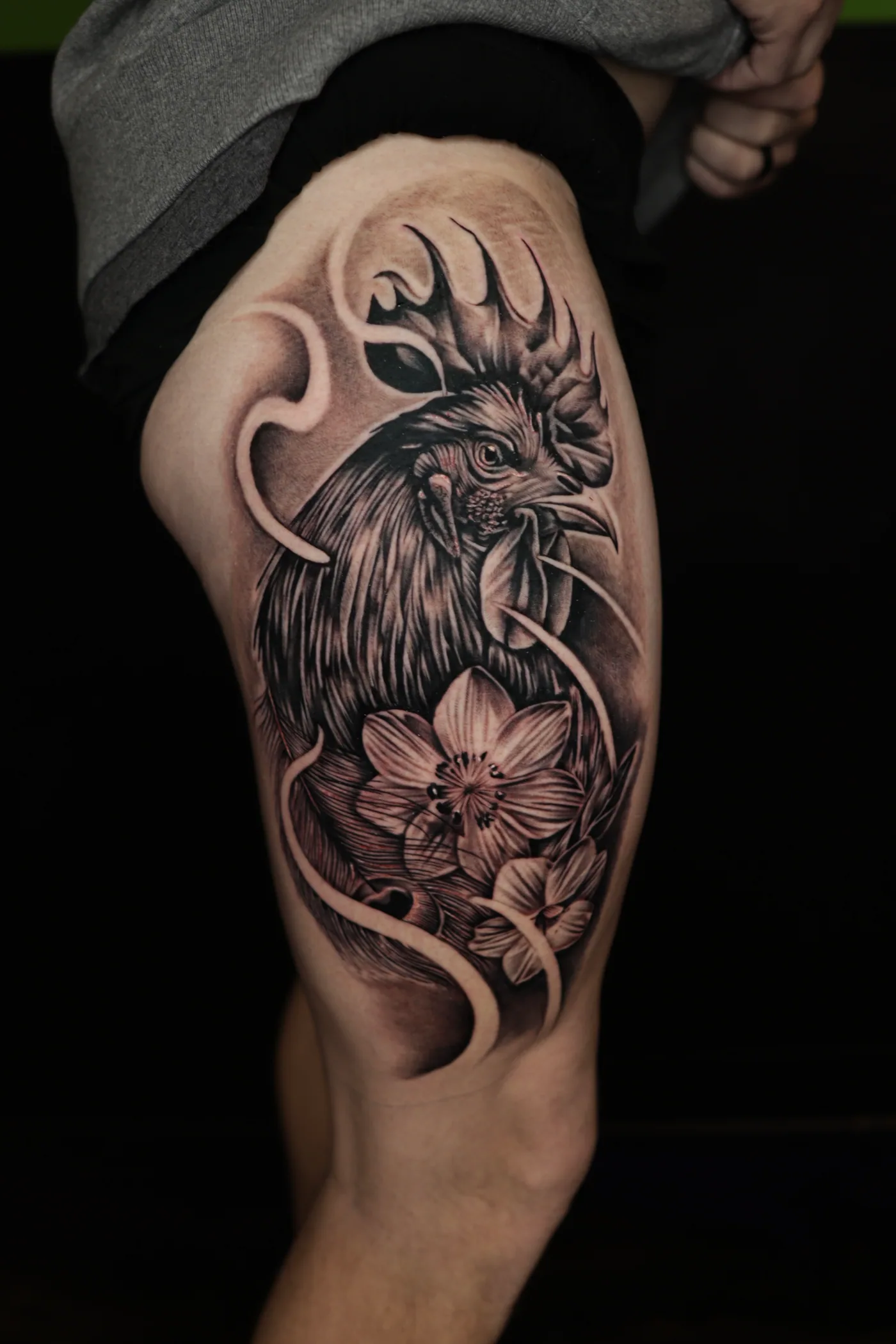 Black and grey upper arm tattoo by Eddie Gonzalez