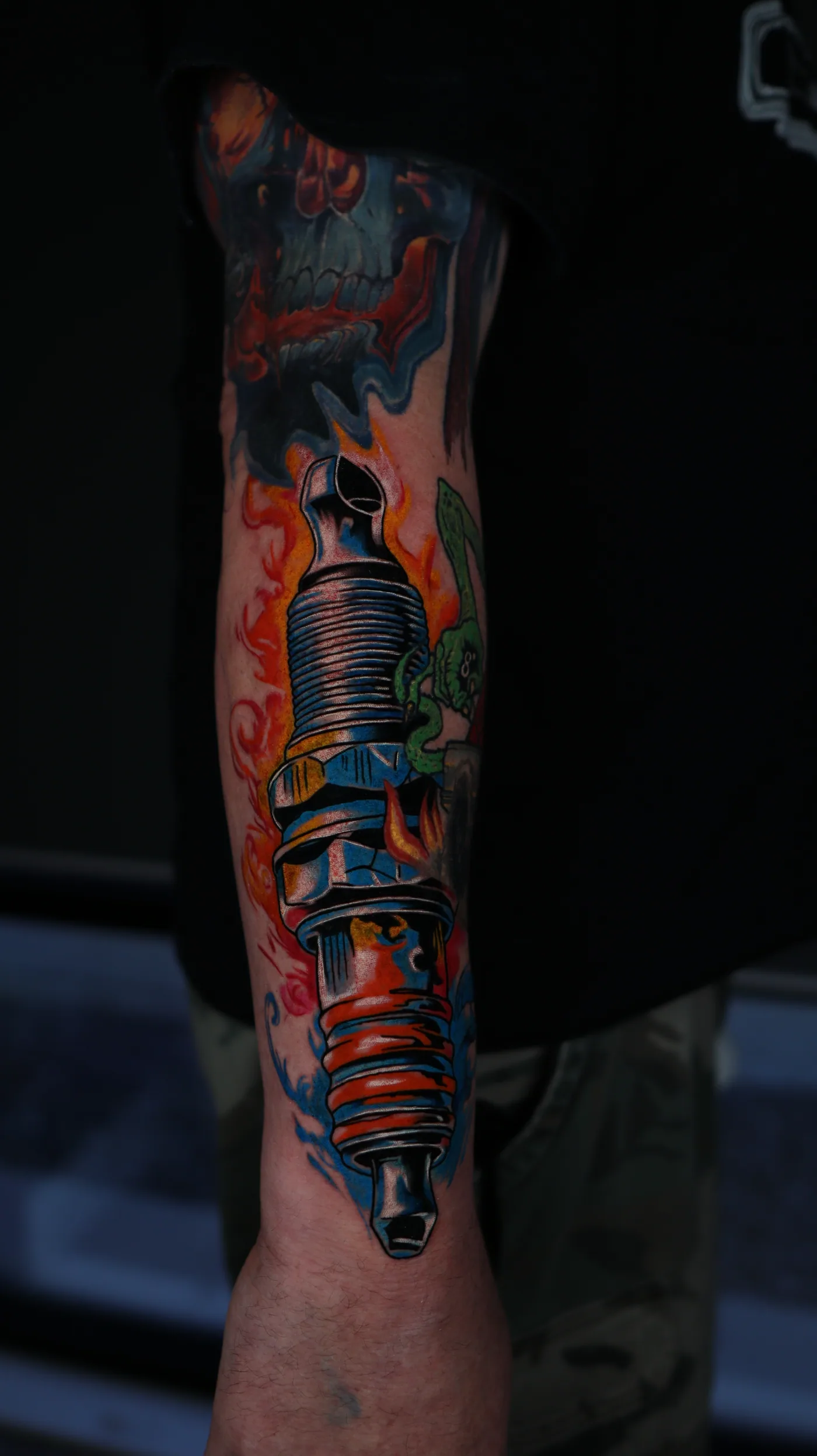 Color-infused forearm tattoo by Eddie Gonzalez