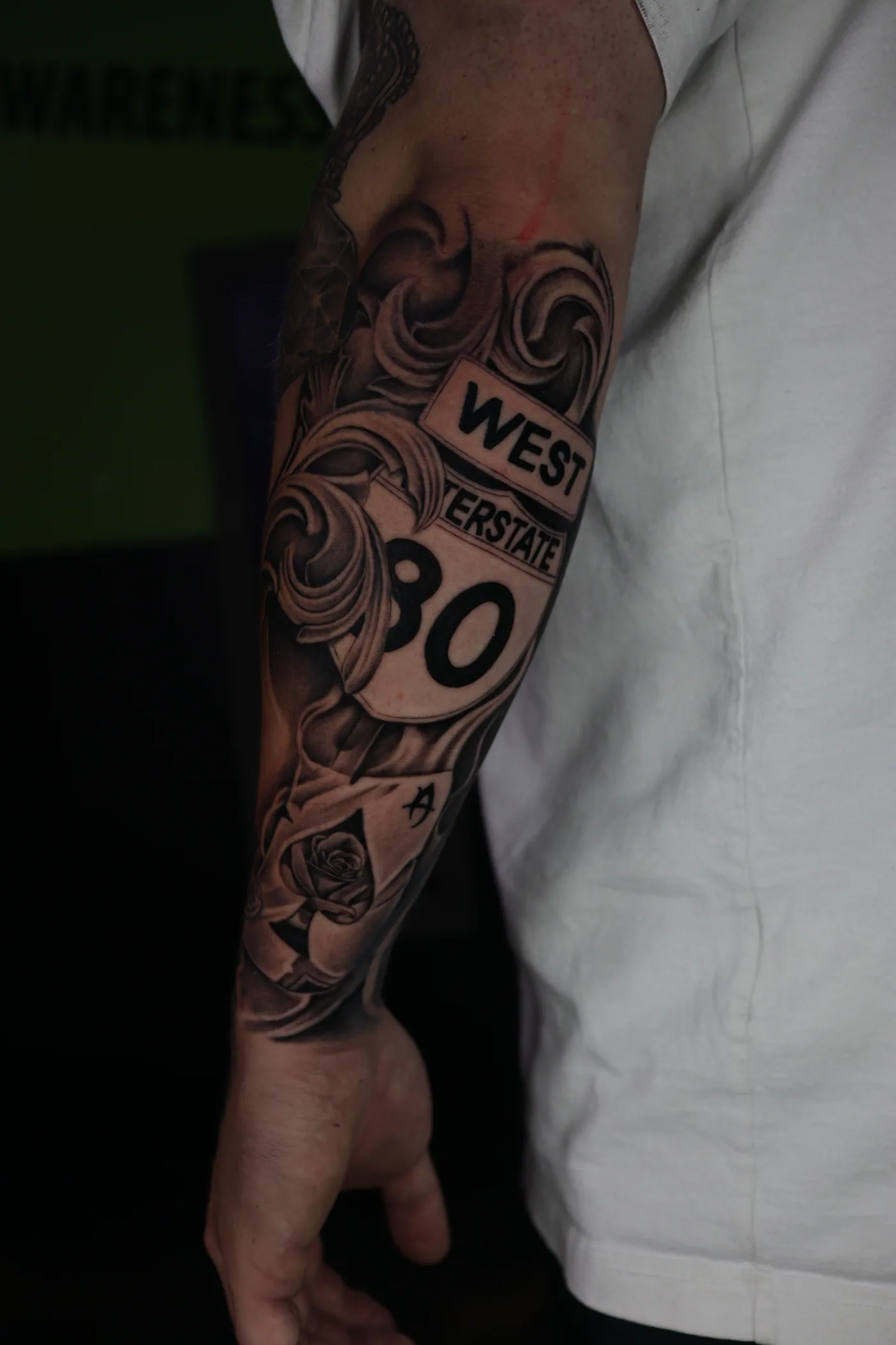 Black and grey sleeve tattoo by Eddie Gonzalez