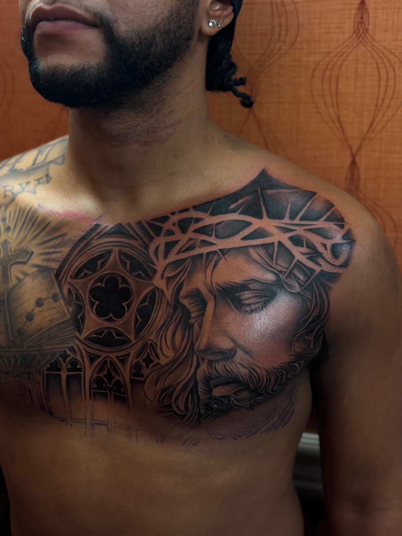 Chest portrait tattoo by Eddie Gonzalez