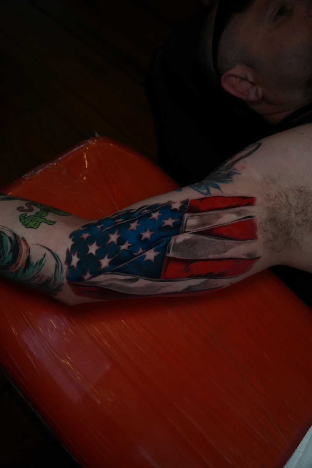 Flag tattoo with red and blue accents